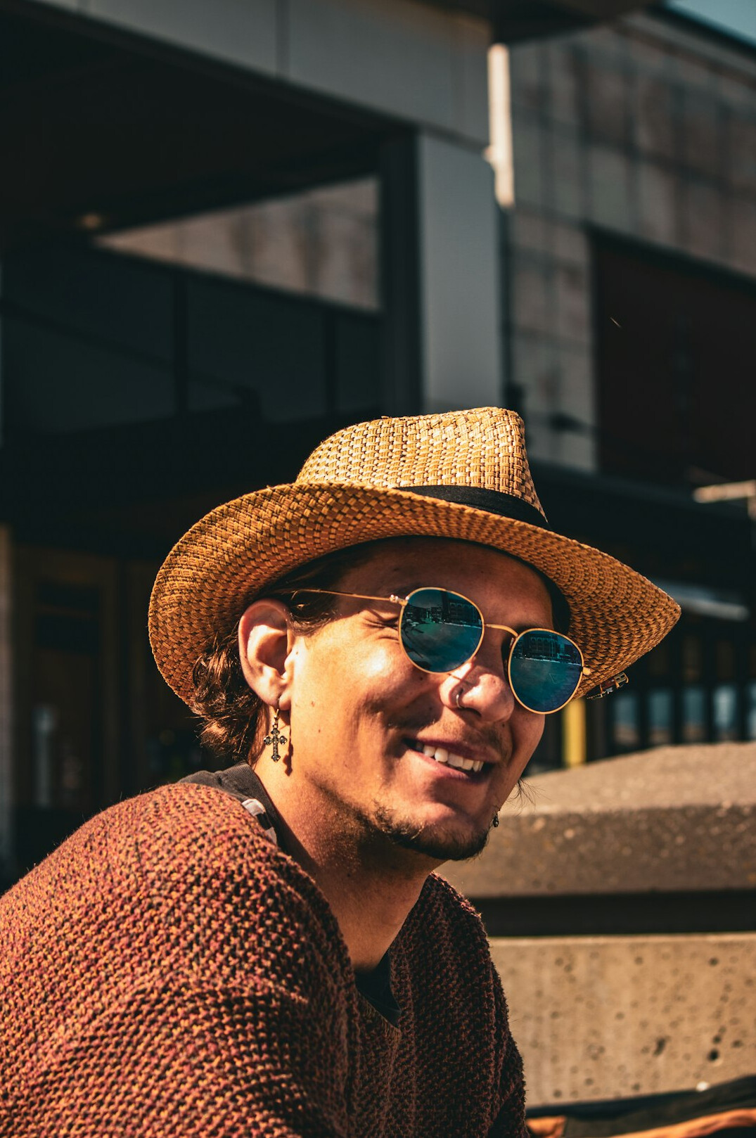 Malay man in his thirties wearing glasses, software engineer, smiling