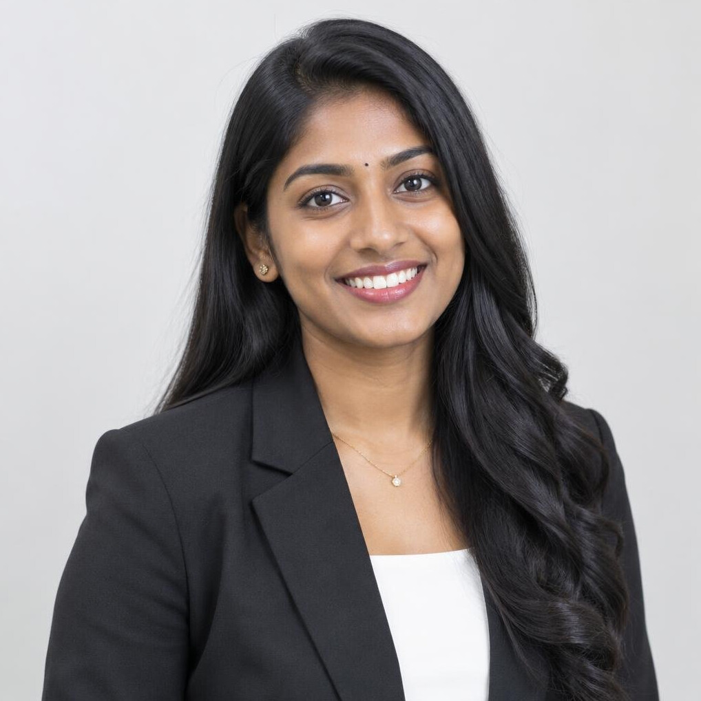 Malaysian Indian woman in her twenties, researcher, smiling