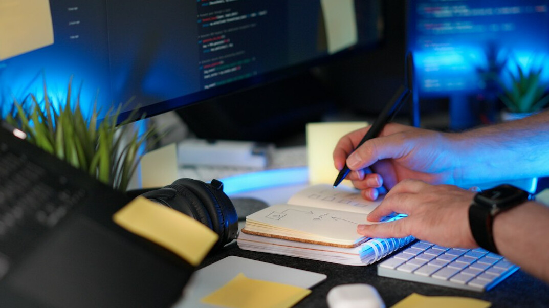 programmer coding at desk